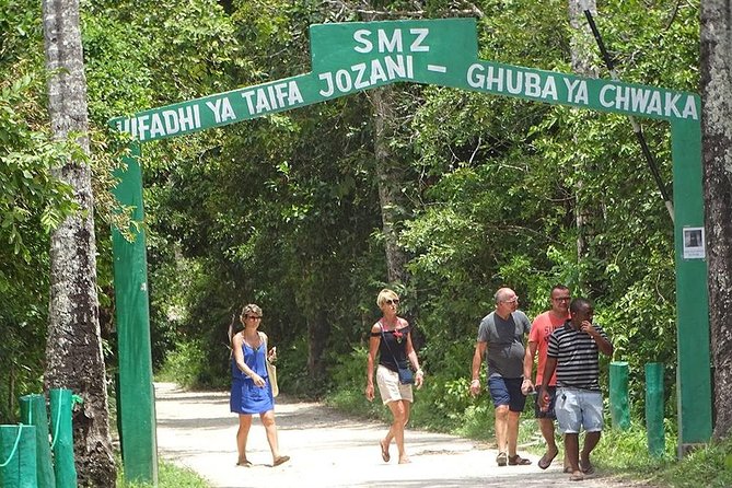 Tourists walking out of the Jozani Forest gate after an adventurous tour in Zanzibar.