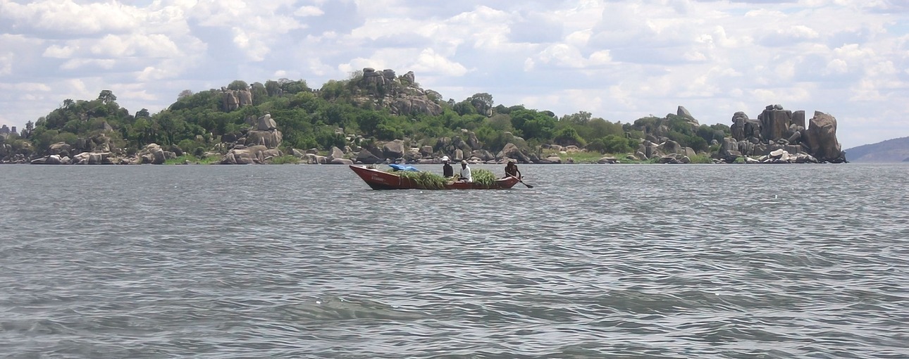 Tourists on a boat ride towards Saanane Island National Park in Tanzania, enjoying the scenic views of Lake Victoria.