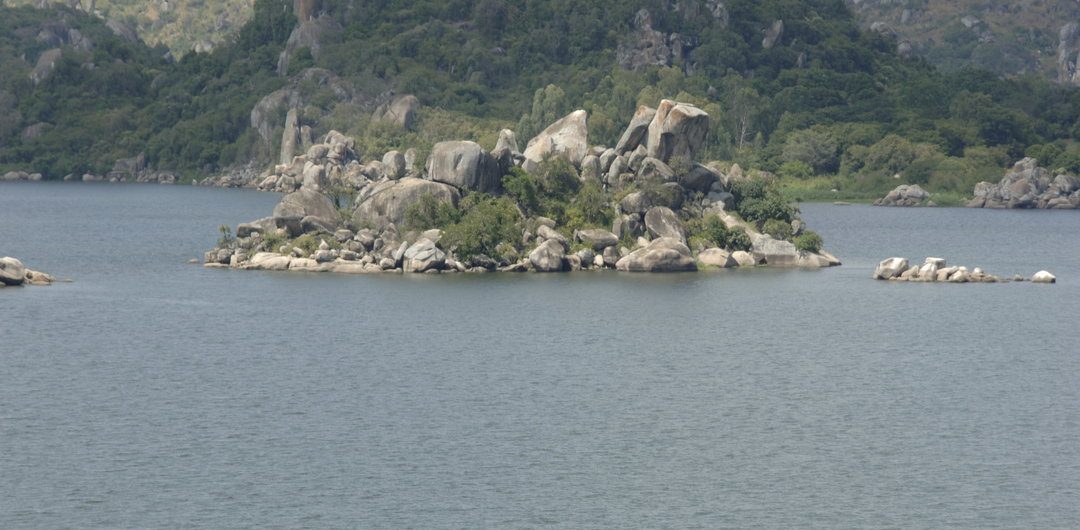 A distant view of Saanane Island National Park, surrounded by the vast waters of Lake Victoria in Tanzania